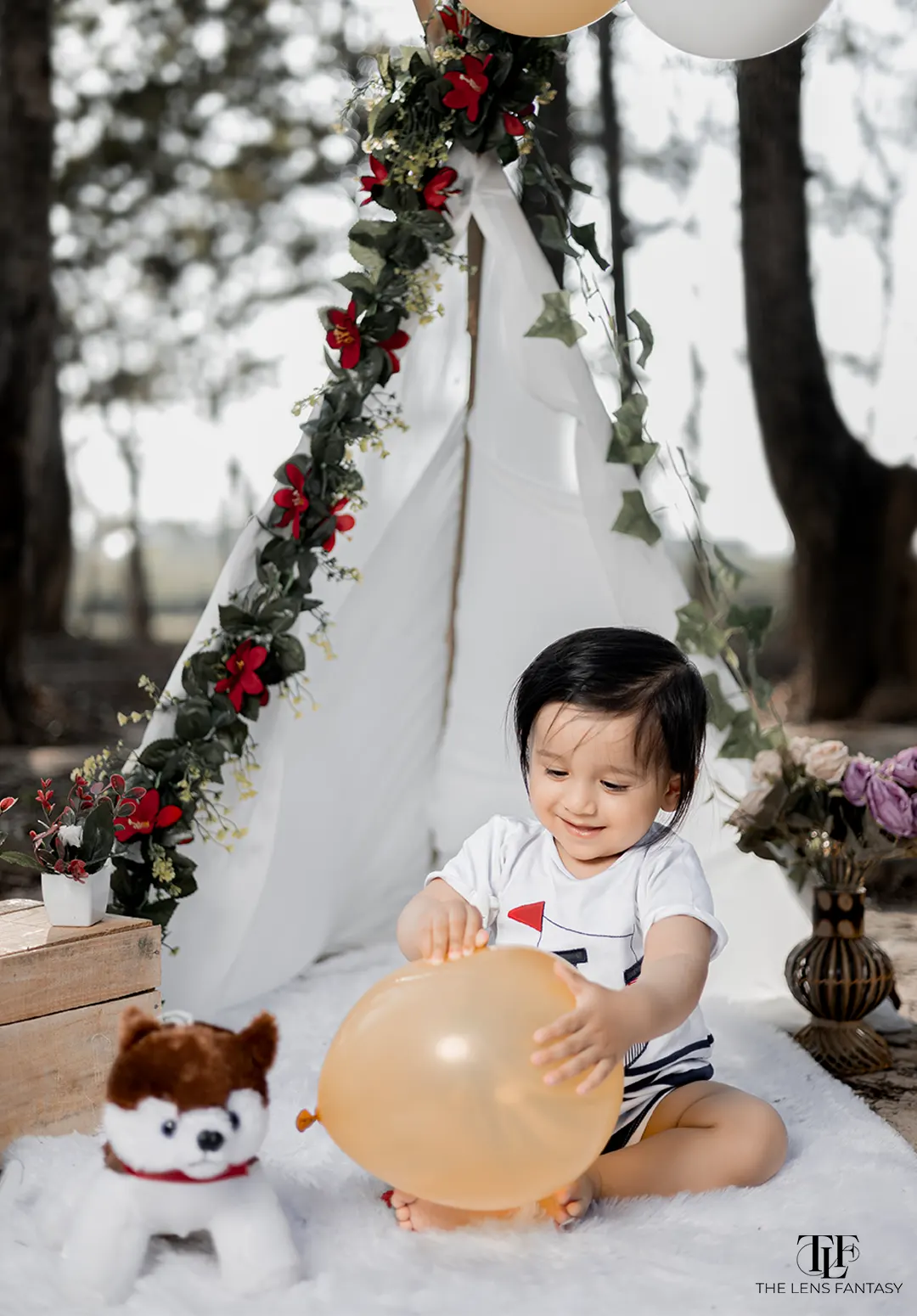 Adorable baby boy pre birthday shoot with pastel balloons by The Lens Fantasy Photography
