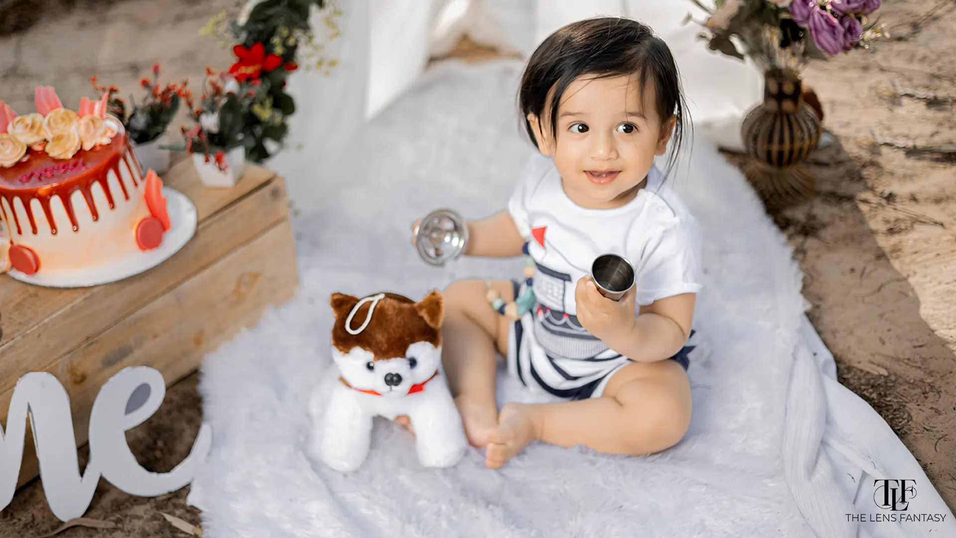 Adorable baby boy pre birthday shoot with pastel balloons by The Lens Fantasy Photography