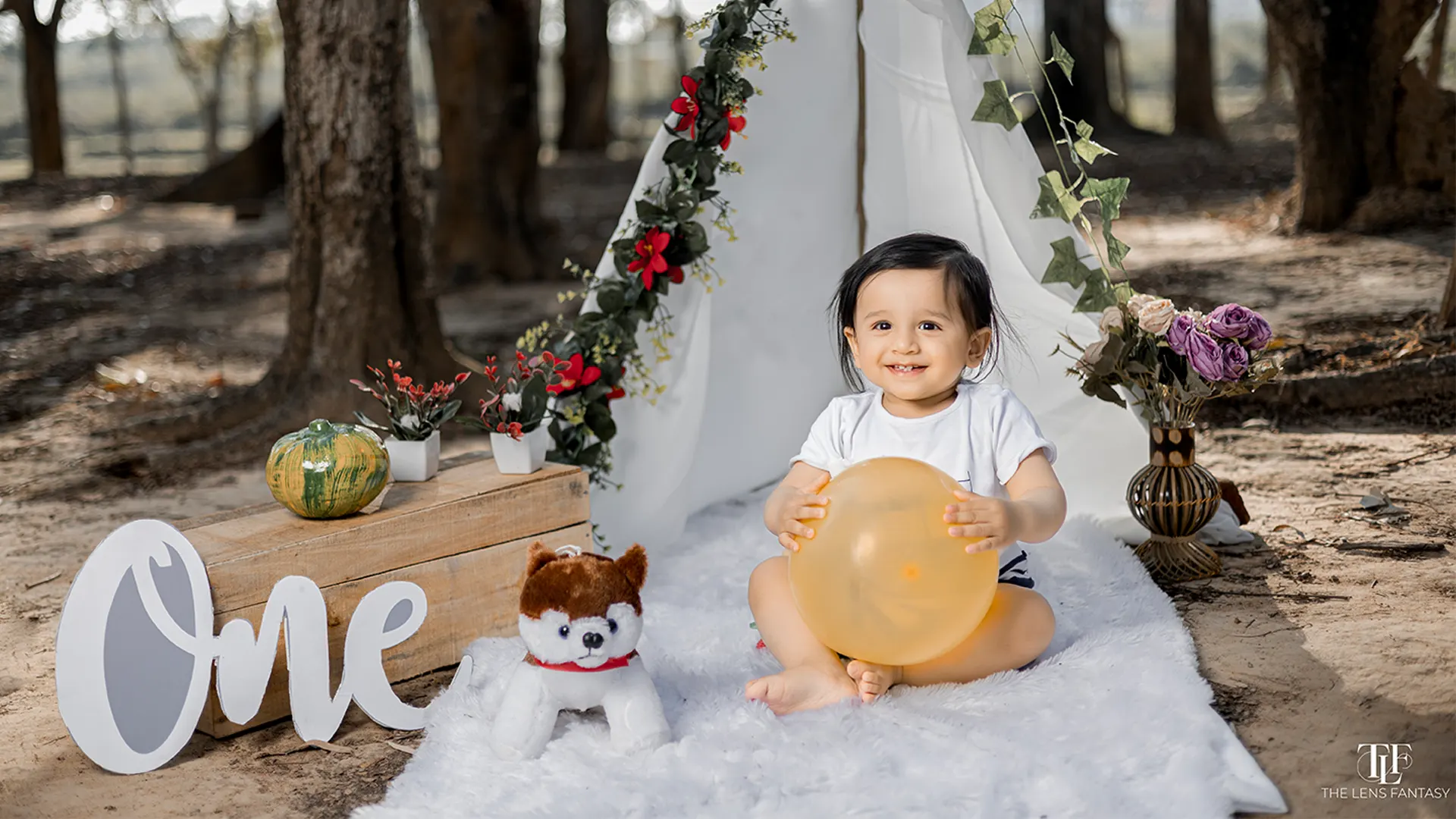 Adorable baby boy pre birthday shoot with pastel balloons by The Lens Fantasy Photography