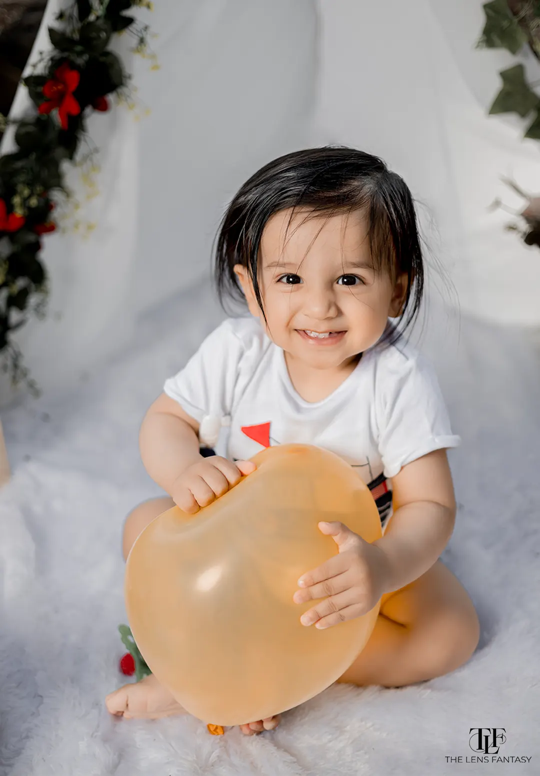 Adorable baby boy pre birthday shoot with pastel balloons by The Lens Fantasy Photography